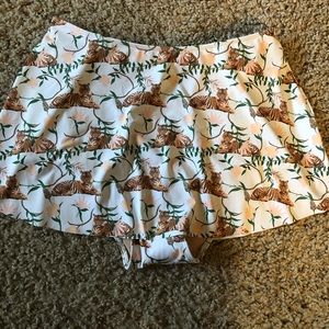 Kortni Jeane who wears short skirts swim bottom